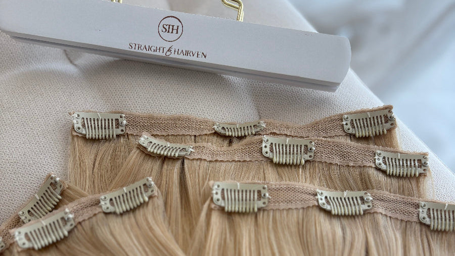 Blonde hair extensions on a hanger with 'STH' branding.